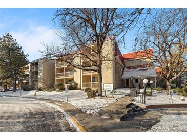 Attractive exterior of a condo building with snow-covered landscaping at 14780 E Kentucky Dr # 414, Aurora, CO 80012