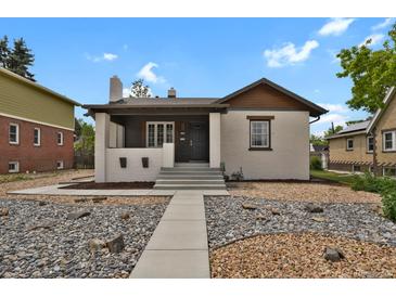 Charming single-Gathering home featuring a well-maintained front yard and inviting entryway at 1455 Hudson St, Denver, CO 80220