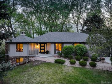 Charming single-story home with lush landscaping, manicured lawn and a welcoming front entrance at 2635 S Lamar Way, Lakewood, CO 80227