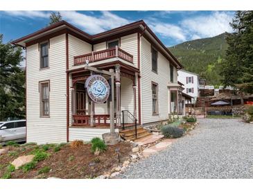 Charming bed and breakfast featuring a quaint porch and beautiful mountain views at 200 Rose St, Georgetown, CO 80444