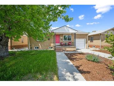 Charming brick home with a well-manicured lawn, a pink front door, and a cozy front porch at 3241 Sheridan Blvd, Wheat Ridge, CO 80212