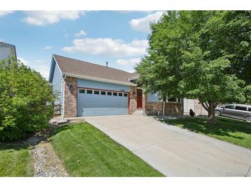 Charming single Gathering home with a long drive, mature trees, and updated siding at 13959 E 106Th Ave, Commerce City, CO 80022