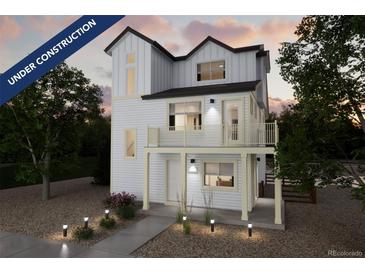 Charming new construction home with a light exterior, a balcony, and professionally landscaped front yard at 13588 E 103Rd Pl, Commerce City, CO 80022