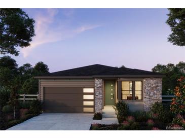 Charming single-Gathering home with stone accents, gray siding, a dark garage door, and a well-manicured front yard at 7350 Goldbloom Ln, Littleton, CO 80125