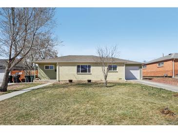 Charming ranch-style home with a well-maintained lawn and attached one car garage at 9271 Gaylord St, Thornton, CO 80229