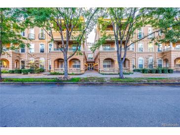 Inviting condo complex with well-maintained landscaping and charming architectural details at 45 N Ogden St # 201, Denver, CO 80218