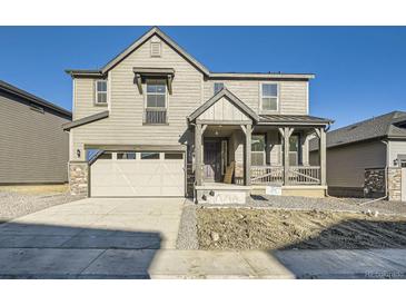 Charming two-story home with neutral siding, covered porch, and attached two-car garage at 2956 S Quaker St, Morrison, CO 80465