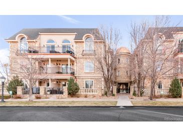 Elegant 3-story building with stone accents and balconies at 150 S Madison St # 112, Denver, CO 80209