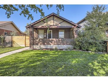 Charming brick home featuring a well-manicured lawn and inviting facade, perfect for curb appeal at 1335 S Sherman St, Denver, CO 80210