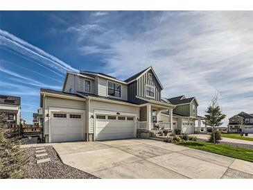 Two-story Craftsman style home with three-car garage and landscaping at 1173 Williams Loop, Elizabeth, CO 80107