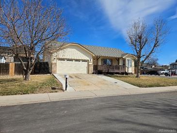 Charming single-Gathering home with attached two car garage and a wooden deck at 808 Idalia St, Aurora, CO 80011