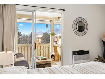 Balcony overlooking scenic mountain views with a seating area and an outdoor fireplace at 3035 Oneal Pkwy # 36T, Boulder, CO 80301