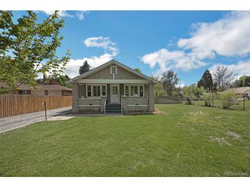 Charming home with front lawn and cozy facade at 7340 W 32Nd Ave, Wheat Ridge, CO 80033
