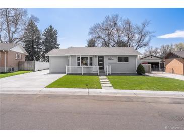 Charming single-story home featuring well-maintained lawn and welcoming front porch at 4164 W Eldorado Pl, Denver, CO 80236
