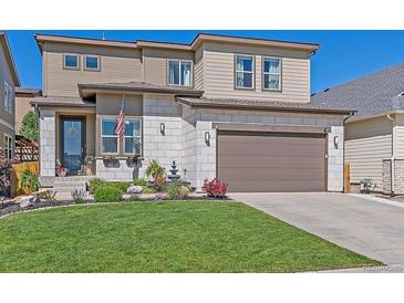 Beautiful two-story home with a well-manicured lawn and charming curb appeal at 1901 Corner Rock Ln, Castle Rock, CO 80108