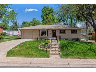 Charming brick ranch home with a well-manicured lawn and inviting curb appeal at 2816 S Wolff St, Denver, CO 80236