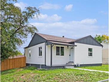 Charming single-story home with a well-maintained lawn and a freshly painted exterior at 2 S Knox Ct, Denver, CO 80219