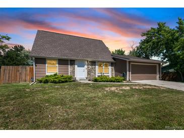 Charming single-Gathering home with well-maintained lawn and two-car garage at 6579 Ingalls St, Arvada, CO 80003