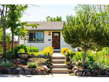 Charming home featuring a cozy entrance with well-kept landscaping and inviting front steps at 1735 S Wyandot St, Denver, CO 80223