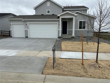 Charming two-story home with a two-car garage and inviting front entrance at 5700 Ranch St, Mead, CO 80504