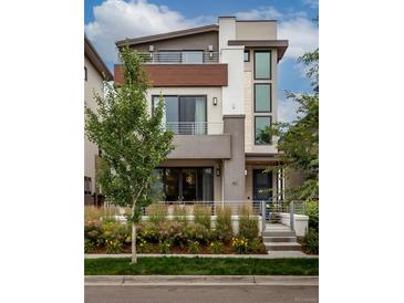 Stunning two-story home boasting a modern design, manicured landscaping, and multiple outdoor terraces at 43 S Oneida Ct, Denver, CO 80230