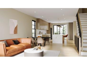 Open living room features a contemporary orange couch and flows into the kitchen at 4305 46Th Ave # 1, Denver, CO 80212