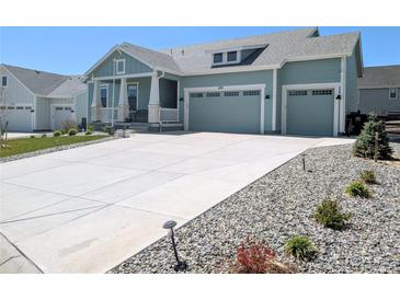 Charming two-story home boasts a spacious driveway and a two-car garage, perfect for modern living at 1030 W Hopkins Dr, Elizabeth, CO 80107