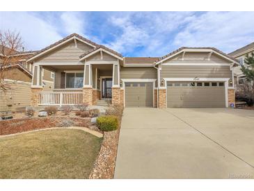 Charming single-Gathering home featuring a well-manicured lawn, porch, and an attached two-car garage at 2342 Bellavista St, Castle Rock, CO 80109