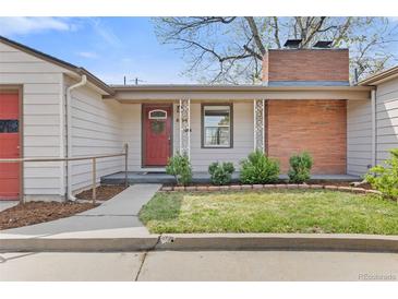 Charming single-story home with a well-maintained front yard and brick chimney at 3198 W Amherst Ave, Denver, CO 80236