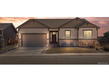Inviting single-story home boasting beautiful stonework, a well-manicured lawn, and a charming front porch seating area at 6420 Agave Ave, Castle Rock, CO 80108