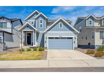 Charming two-story home with a two-car garage and low maintenance front yard at 27837 E 8Th Ave, Aurora, CO 80018