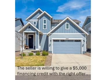 Charming two-story home featuring a two-car garage and covered porch at 27837 E 8Th Ave, Aurora, CO 80018