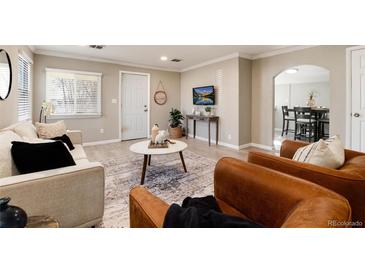 Cozy living room featuring neutral tones, stylish furnishings, and an inviting atmosphere at 377 Stuart St, Denver, CO 80219