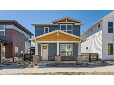 Charming two-story home with a covered porch and craftsman-style detailing at 920 Promenade Dr, Superior, CO 80027