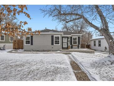 Gray house with black shutters, snowy front yard, and walkway at 2354 S Ogden St, Denver, CO 80210