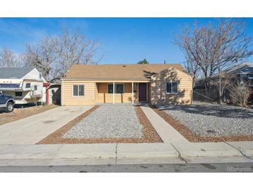 Charming single-story home with an inviting exterior and well-maintained gravel front yard at 1934 Macon St, Aurora, CO 80010