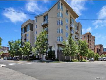 Modern multi-unit building in urban setting with tree-lined street at 290 W 12Th Ave # 401, Denver, CO 80204