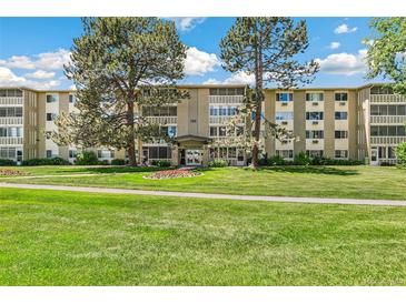 Charming multi-story building with mature trees and well-maintained landscaping and inviting entryway at 725 S Alton Way # 9C, Denver, CO 80247