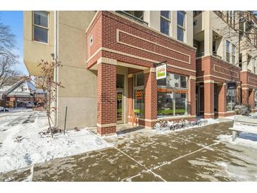 Brick building exterior with snow on the ground at 4383 Tennyson St # 1A, Denver, CO 80212