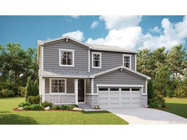 Charming two-story home with gray siding, stone accents, and an attached two-car garage at 6995 E 126Th Dr, Thornton, CO 80602