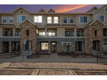 Inviting condo exterior with well-maintained landscaping and attractive architectural details at 452 Black Feather Loop # 606, Castle Rock, CO 80104