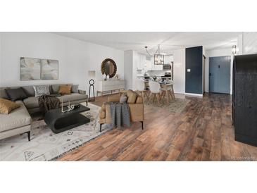 Living room featuring stylish furnishings, wood floors, and contemporary decor at 7020 E Girard Ave # 209, Denver, CO 80224