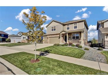 Two-story house with attached garage and landscaped yard at 20727 Park Hollow Dr, Parker, CO 80138