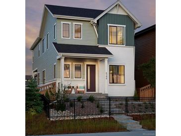 Charming two-story home with a cozy front porch and professionally landscaped yard at 6244 N Lisbon St, Aurora, CO 80019