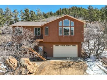 Two story home with attached garage and mountain views at 113 Oakdale Dr, Palmer Lake, CO 80133