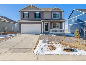 Charming two-story home features a large driveway, two-car garage, and covered front porch at 3226 Belleville Ridge Rd, Elizabeth, CO 80107