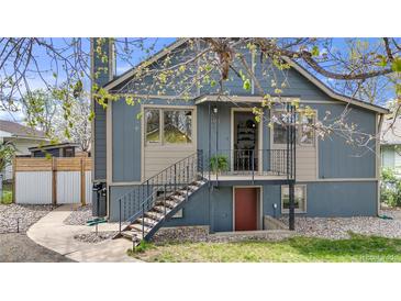 Charming two-story home featuring a raised porch, garden-level entry, and fresh exterior paint in a lovely suburban setting at 505 S Roosevelt Rd, Lafayette, CO 80026