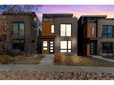 Modern brick home with a minimalist design and striking curb appeal in an urban setting at 2625 W 23Rd Ave, Denver, CO 80211
