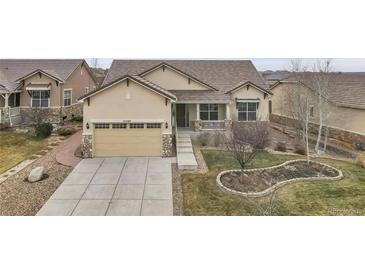 Ranch style home with a landscaped yard and two-car garage at 4280 Crystal Dr, Broomfield, CO 80023