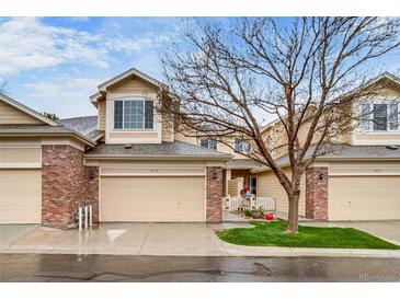Charming townhome with a two-car garage and beautifully maintained front yard at 3179 S Indiana St, Lakewood, CO 80228